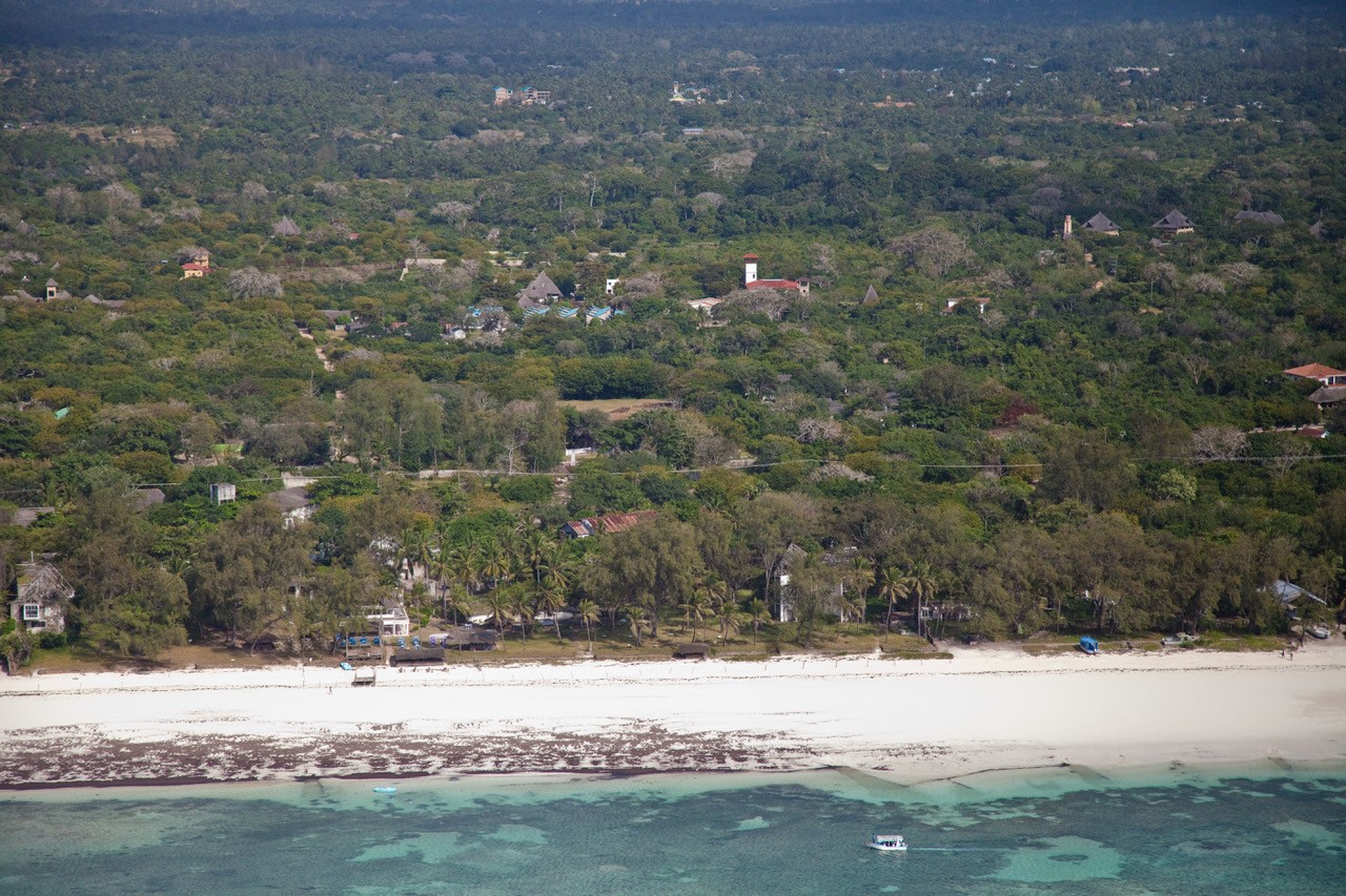 Msitu Kwetu · wide aerial view of the south coast with Diani Beach and the Indian Ocean