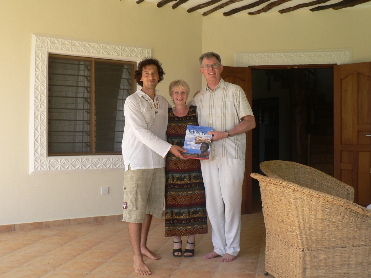 Bernd Trompell handing over the keys to Gil after the completion of his house in Diani Beach, Kenya