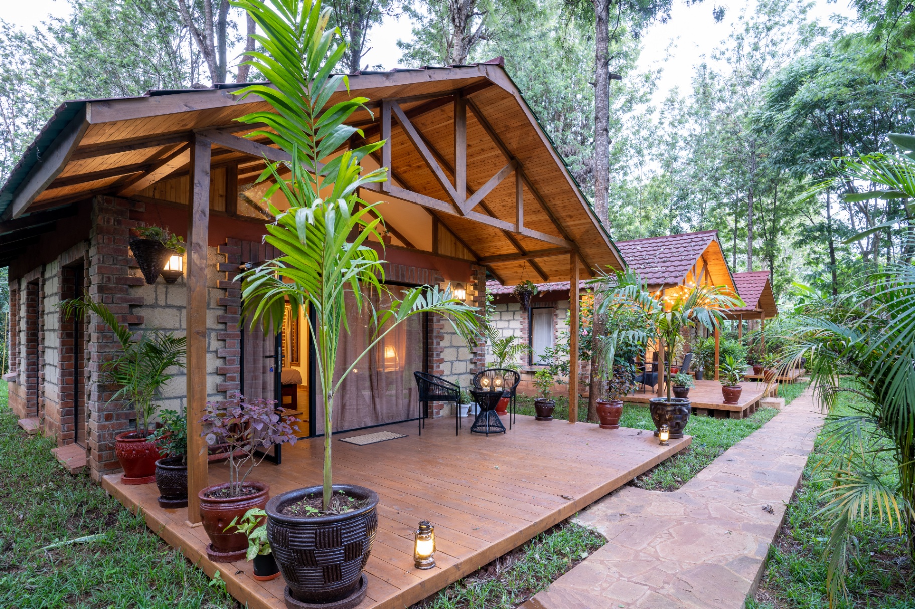 Jungle Oasis — cottage exterior with timber porch