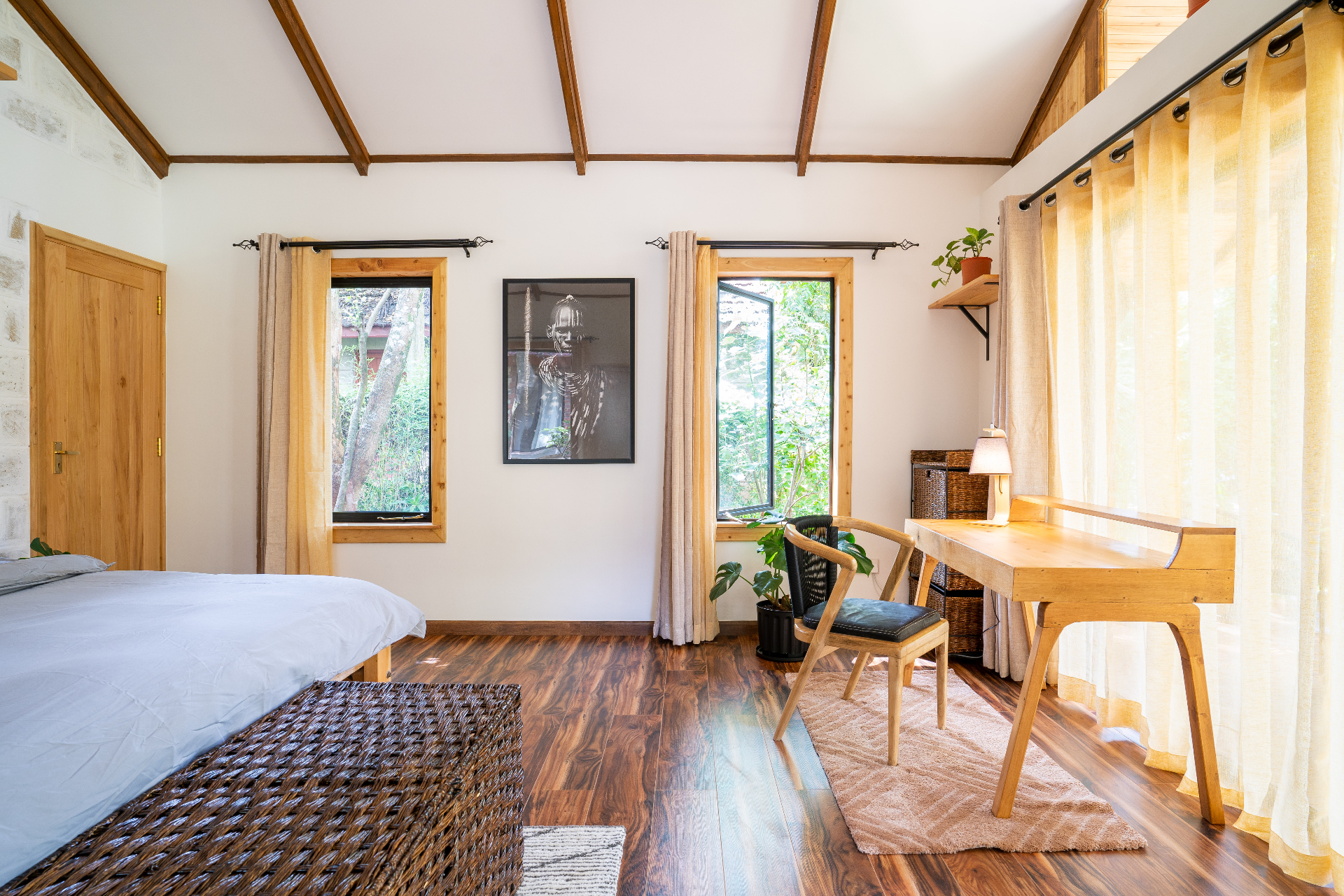 Jungle Oasis — bedroom interior with hardwood floors and writing desk